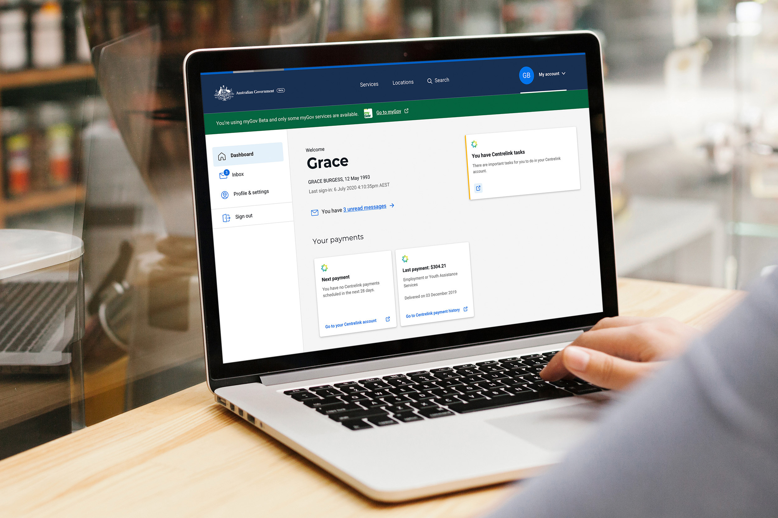 Laptop mockup of MyGov Beta dashboard.