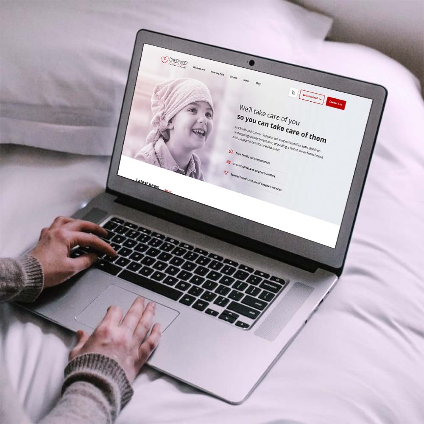 Laptop mockup of Childhood Cancer Support homepage.